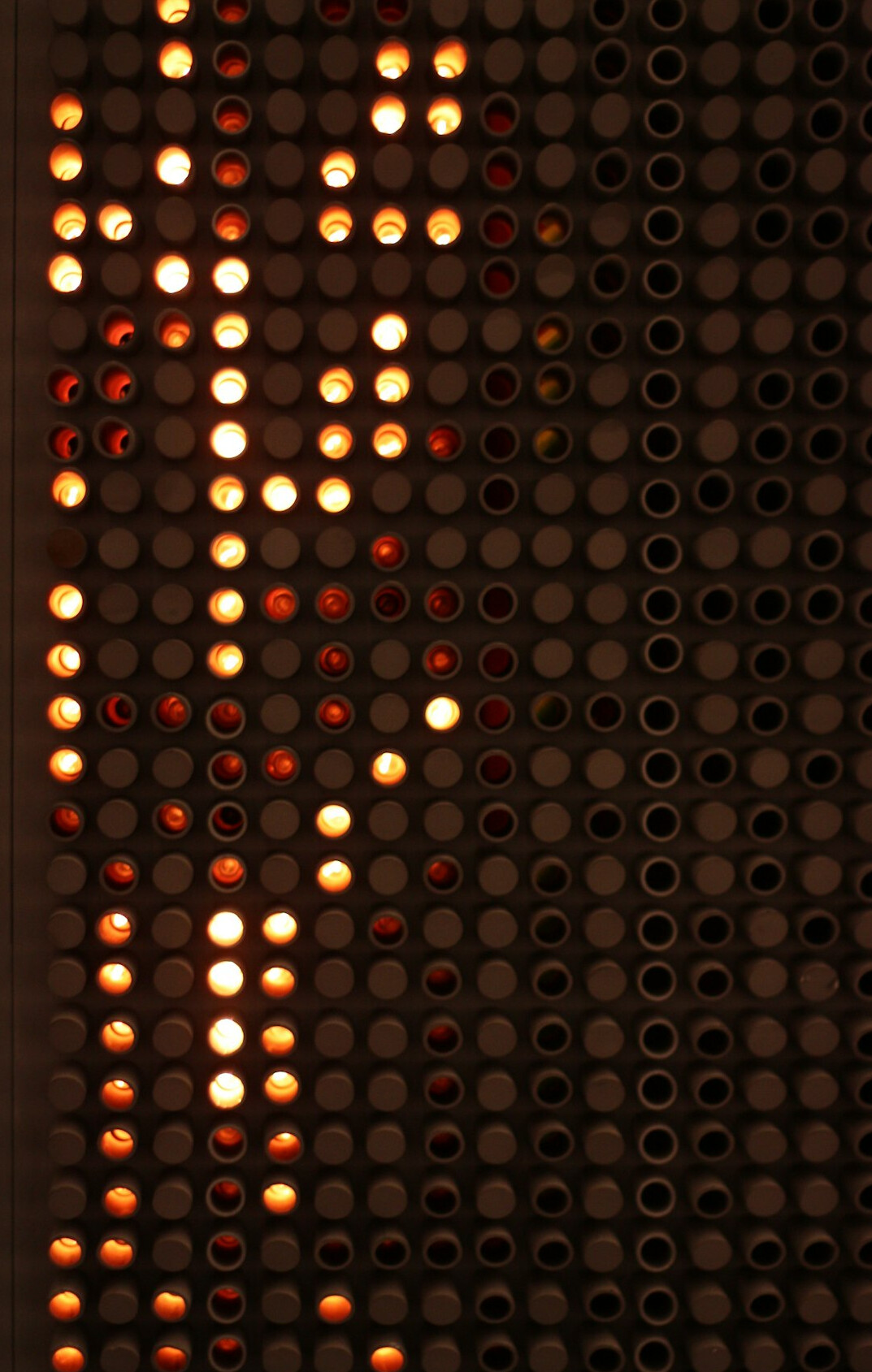 Close-up of a server rack with blinking lights representing automated systems