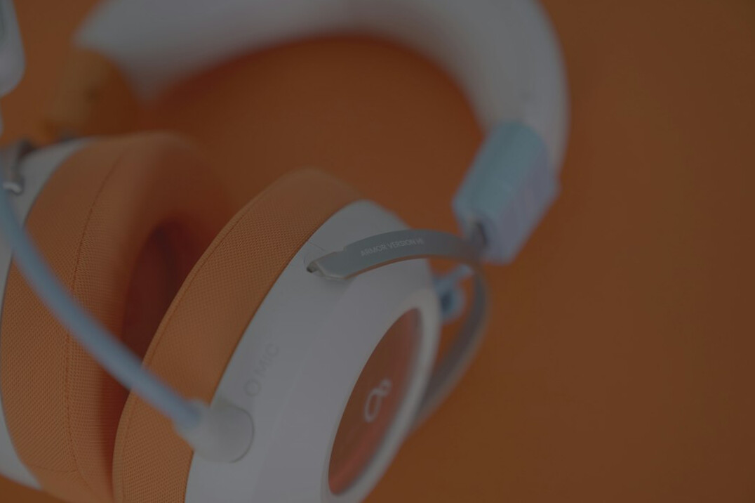 Customer support representative working at a desk with a headset
